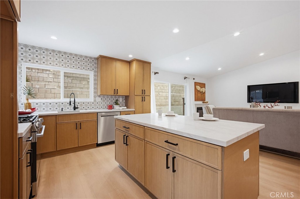 7355 Vineyard Avenue Rancho Cucamonga, CA 91730 - Photo 12 of 38 a kitchen with sink stove and refrigerator