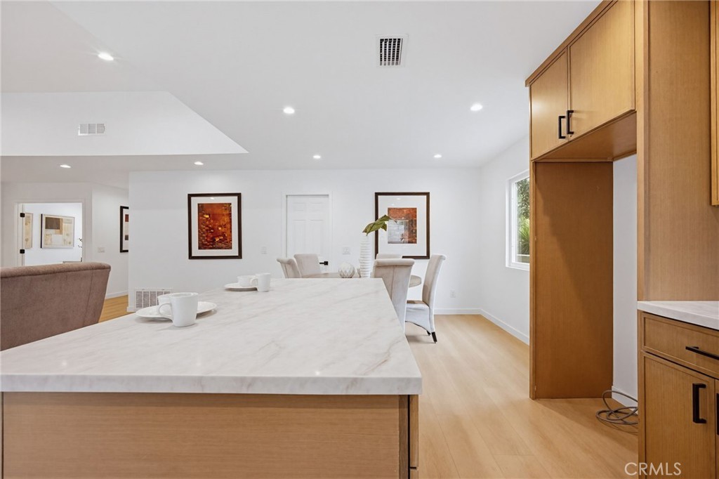 7355 Vineyard Avenue Rancho Cucamonga, CA 91730 - Photo 13 of 38 a bed room with a bed and a view of kitchen