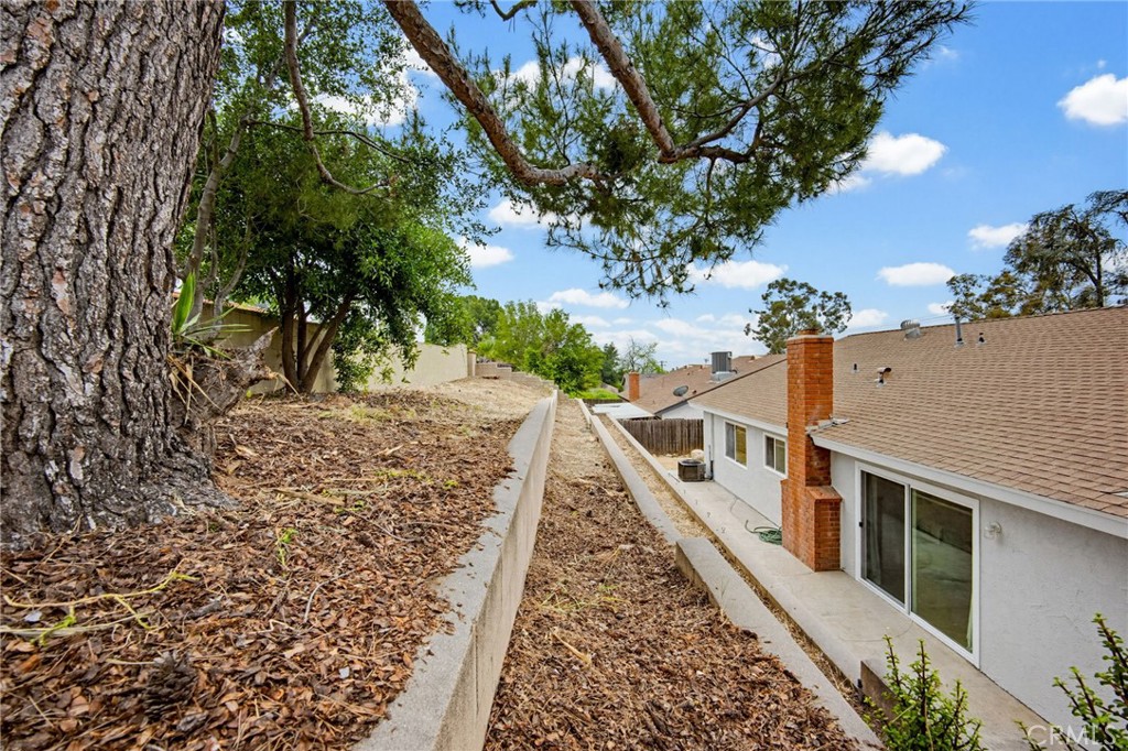 7355 Vineyard Avenue Rancho Cucamonga, CA 91730 - Photo 35 of 38 a view of a house with a yard