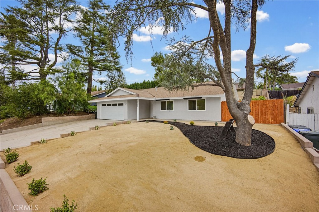 7355 Vineyard Avenue Rancho Cucamonga, CA 91730 - Photo 37 of 38 a front view of a house with garden