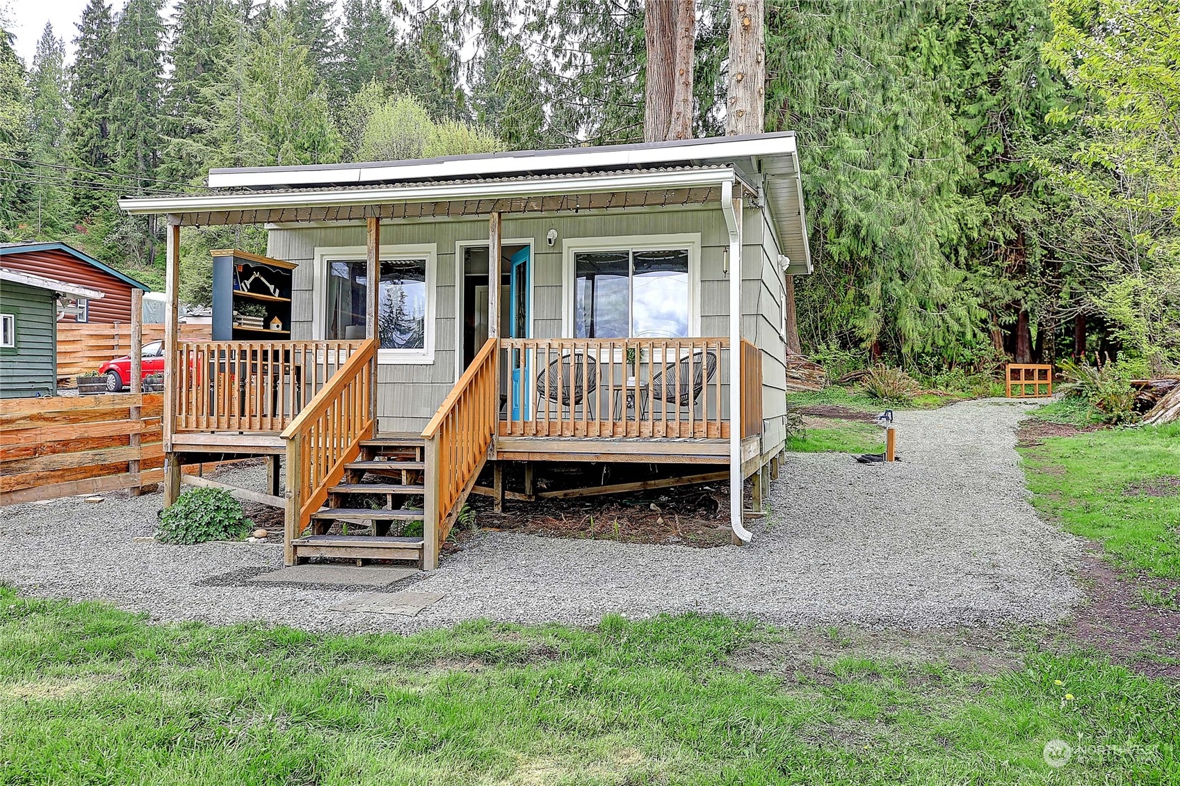 18818 Lerch Road Snohomish, WA 98290 - Photo 2 of 36 a view of a house with a yard and park bench