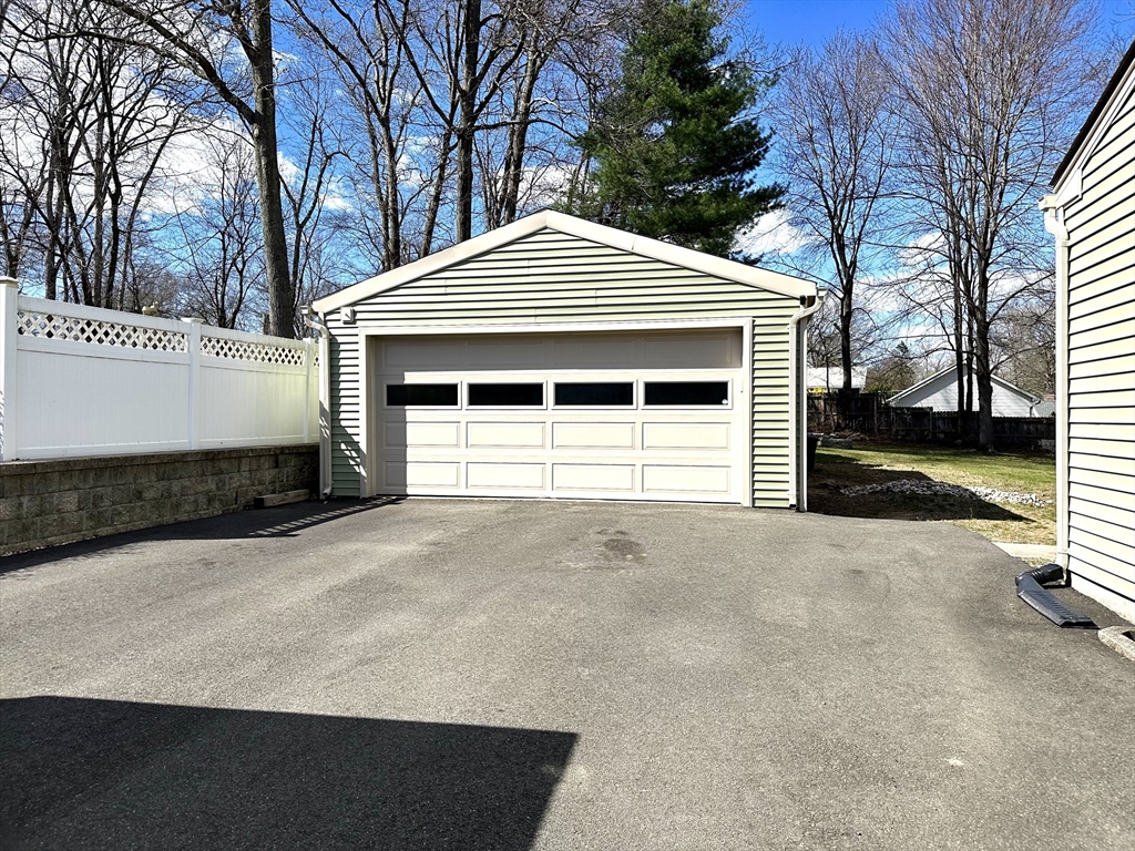 98 Corey Road Springfield, MA 01128 - Photo 24 of 24 a front view of a house with a yard and garage