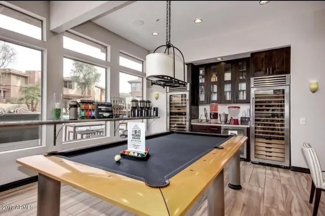 a kitchen with counter top space and wooden floor