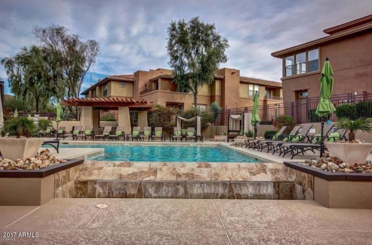19777 North 76th Street, Unit 3186 Scottsdale, AZ 85255 - Photo 19 of 23 a front view of a house with a yard and fountain