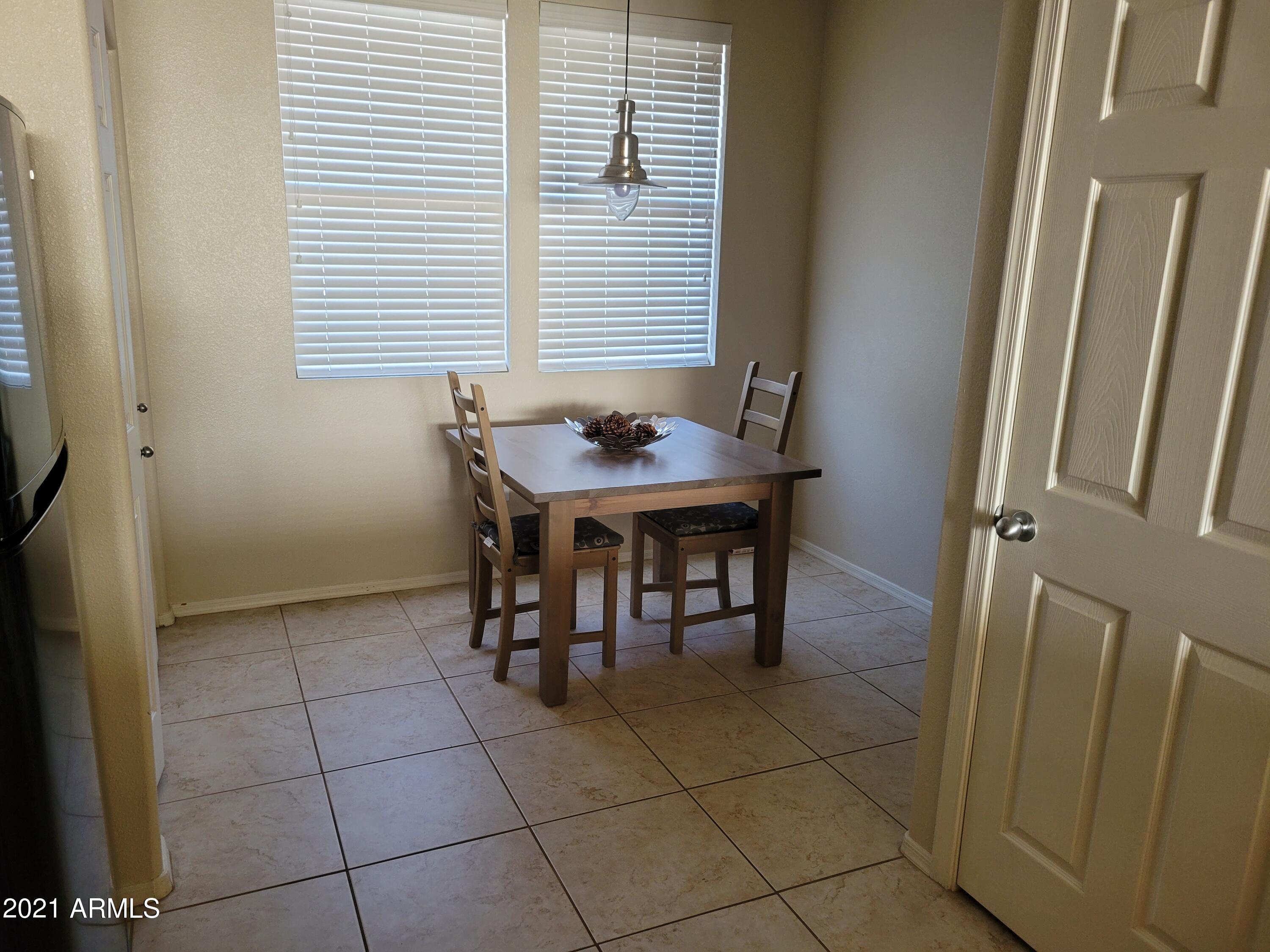 19777 North 76th Street, Unit 3186 Scottsdale, AZ 85255 - Photo 5 of 23 a view of a dining room with furniture and window