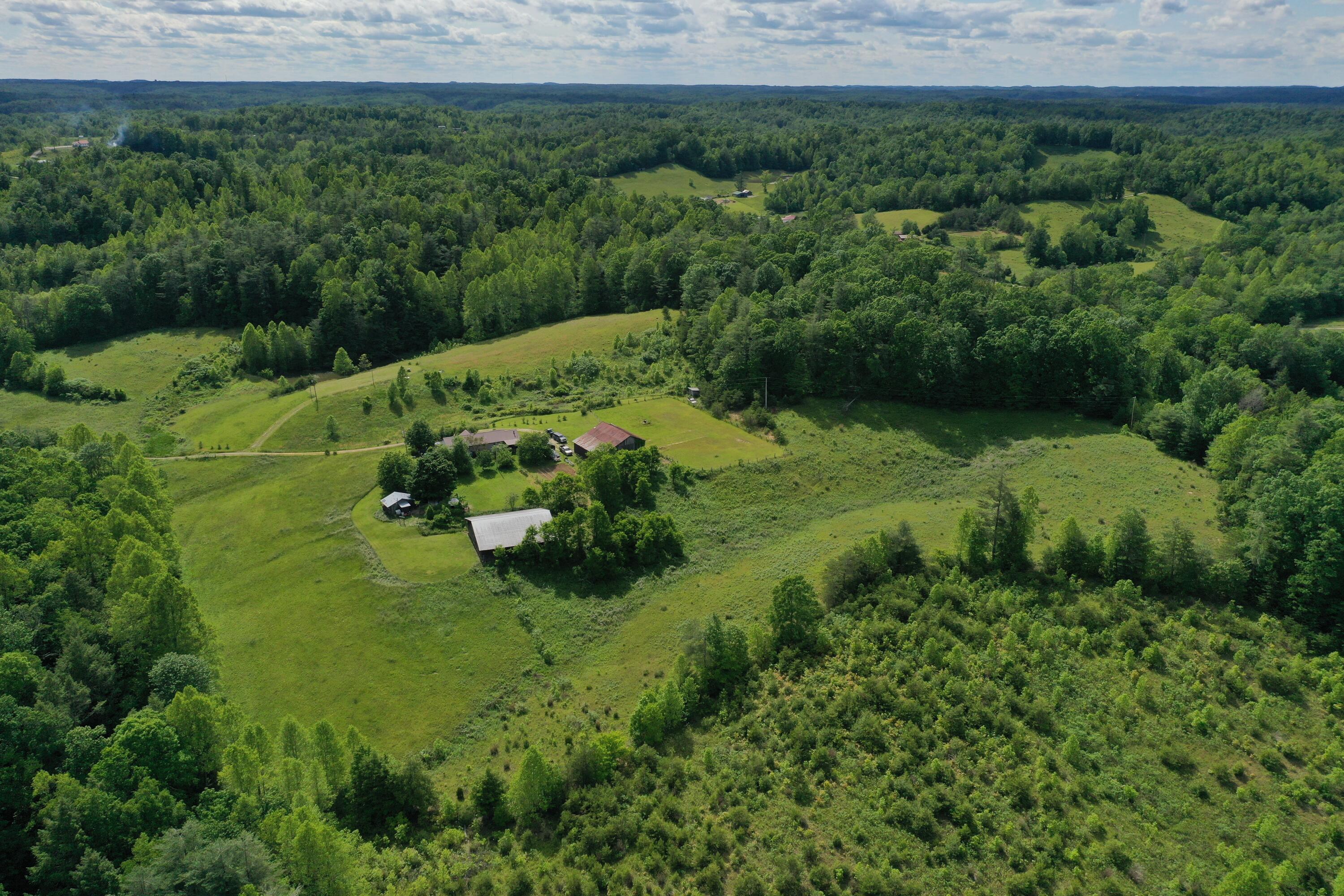 342 Dewey Banks Road Campton, KY 41301 - Photo 7 of 64 007 aerial drone shot from the north loo