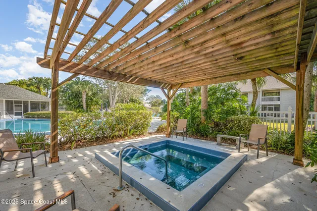 a view of a swimming pool with a yard