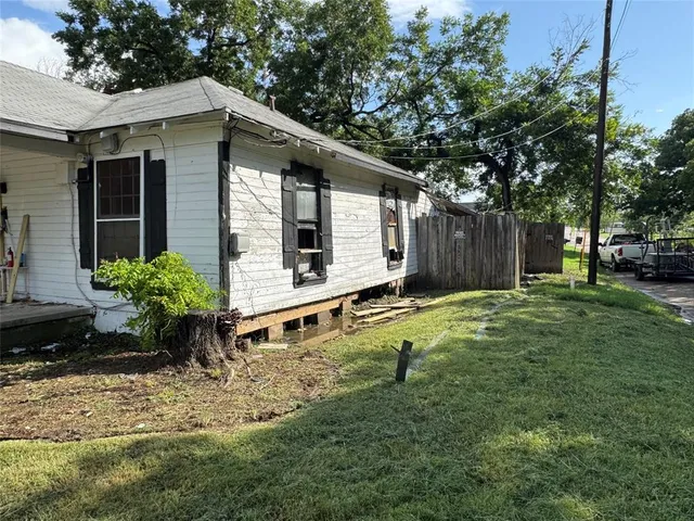 a house with trees in the background