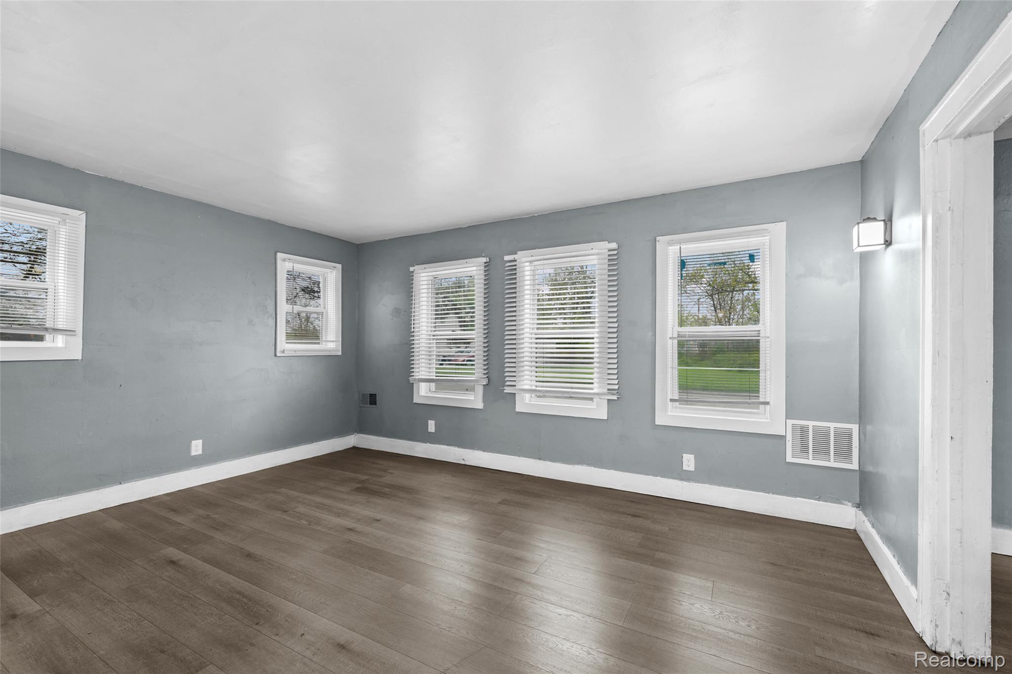 3605 Ash Street Inkster, MI 48141 - Photo 7 of 25 Empty room with dark wood-style floors and baseboards