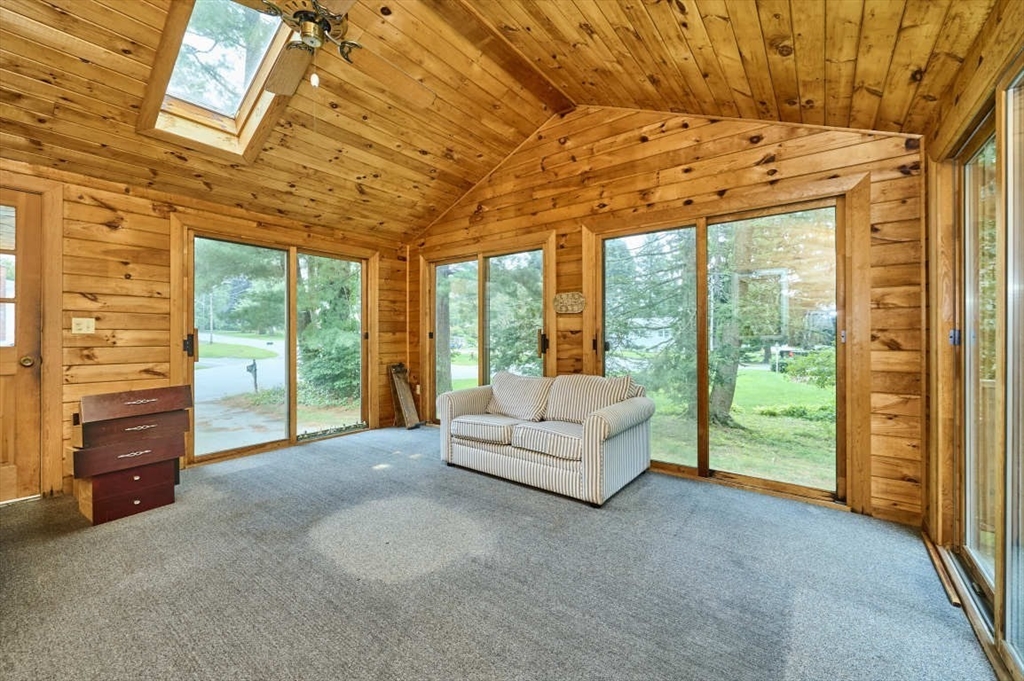 9 Bowman Road Billerica, MA 01821 - Photo 3 of 23 a living room with furniture and a flat tv screen