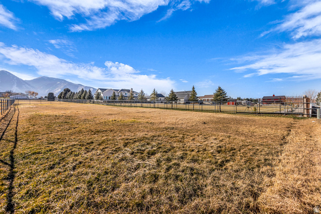 1060 West 2620th Street South Mapleton, UT 84664 - Photo 71 of 87 View of yard with a mountain view and a rural view