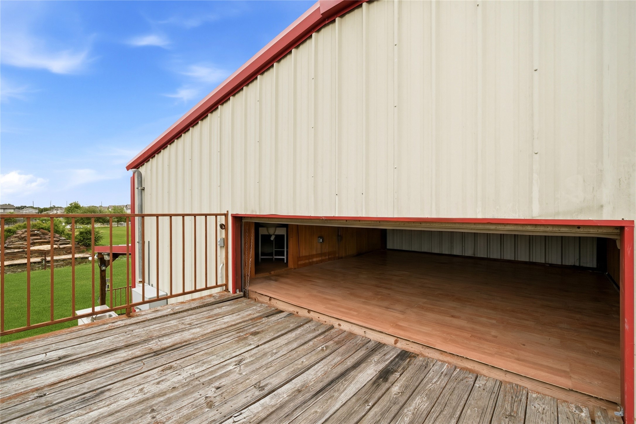 11741 Ezekiel Road Tomball, TX 77375 - Photo 20 of 30 a view of a balcony with wooden floor and fence