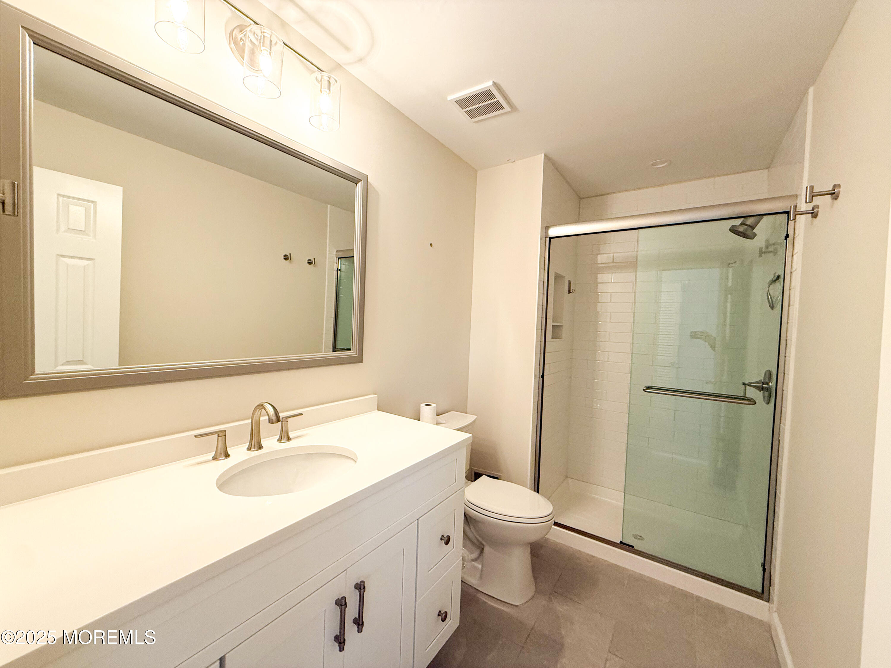 17 Apple Drive Spring Lake, NJ 07762 - Photo 13 of 15 a bathroom with a sink toilet and shower