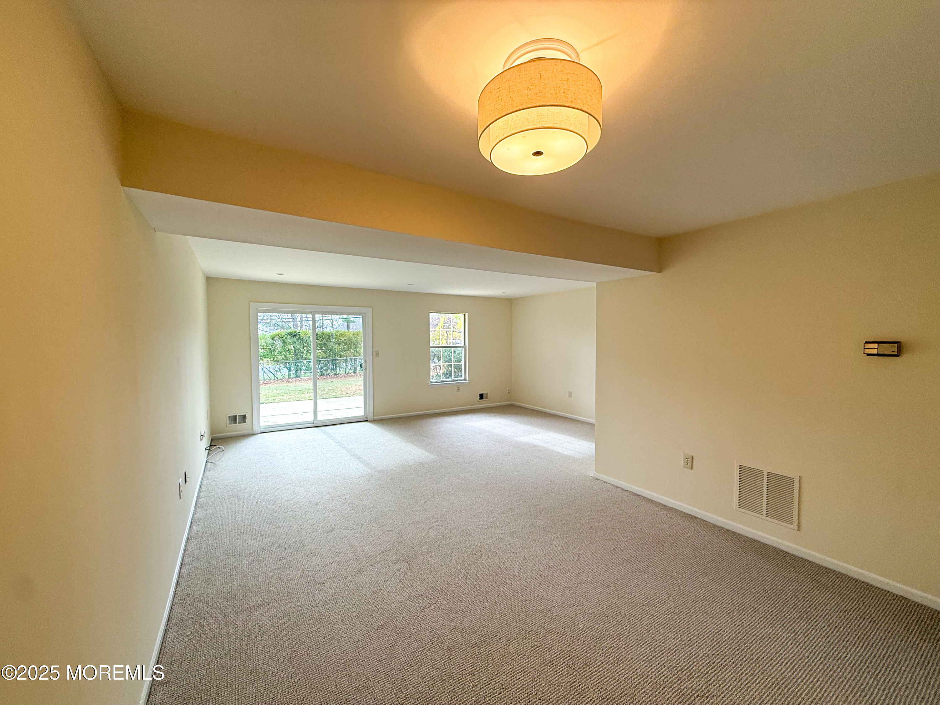 17 Apple Drive Spring Lake, NJ 07762 - Photo 3 of 15 an empty room with windows