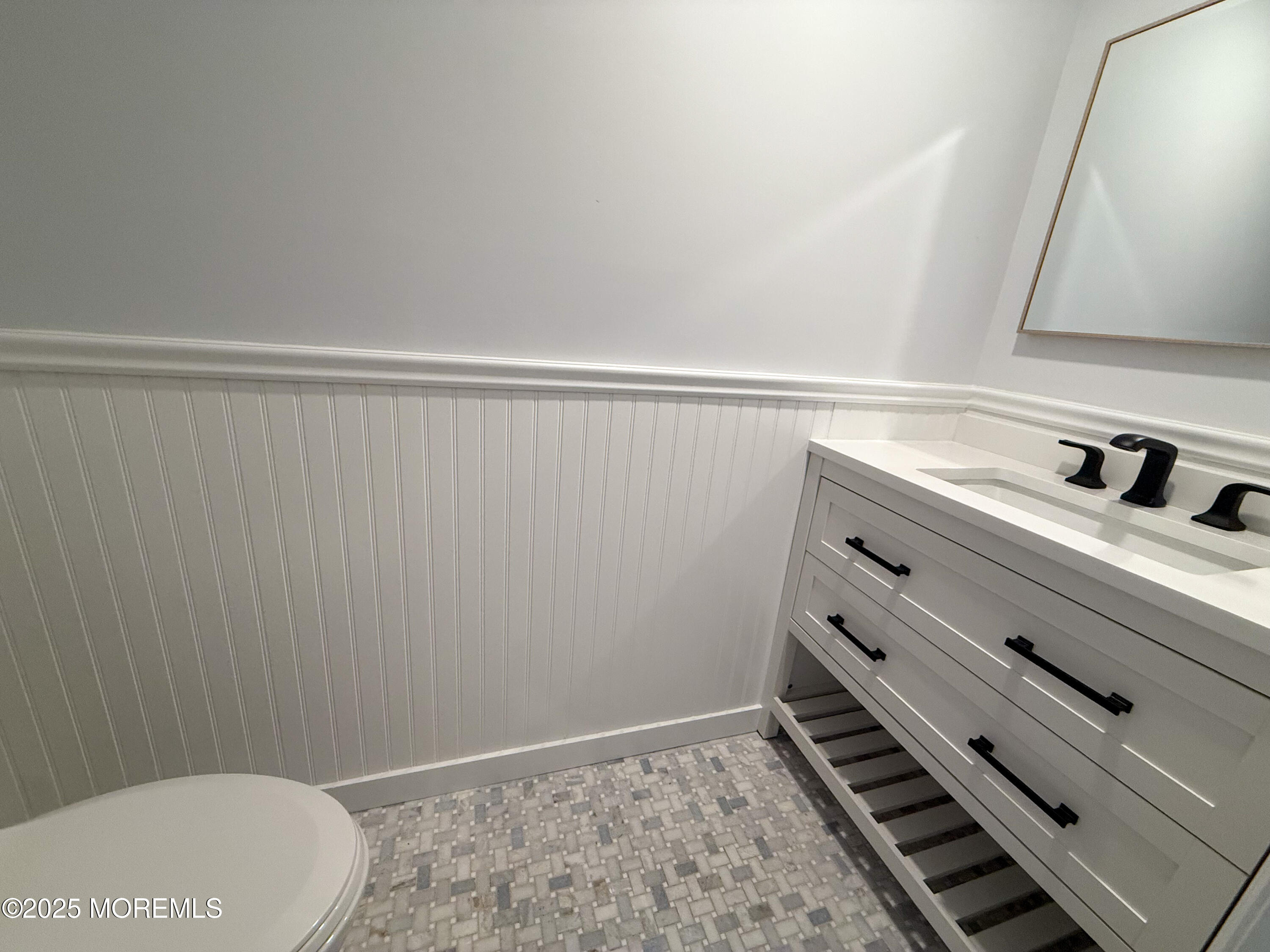 17 Apple Drive Spring Lake, NJ 07762 - Photo 7 of 15 a bathroom with a sink and a toilet