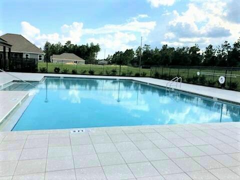 828 Otto Loop Crestview, FL 32539 - Photo 3 of 31 swimming pool view with a outdoor space
