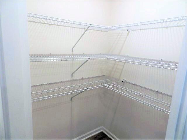 828 Otto Loop Crestview, FL 32539 - Photo 8 of 31 a view of a room with racks on the wall