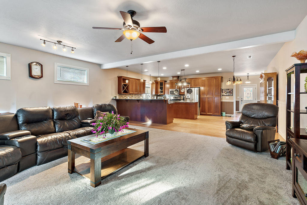 2198 Rabun Way Central Point, OR 97502 - Photo 32 of 47 a living room with furniture kitchen view and a chandelier