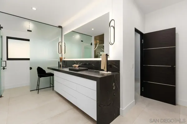 a kitchen with a refrigerator and a sink