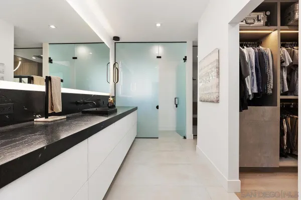 a kitchen with stainless steel appliances a refrigerator and a sink