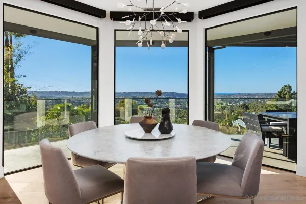 a dining room with furniture a window and a table