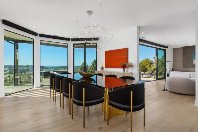 a view of a dining room with furniture window and outside view