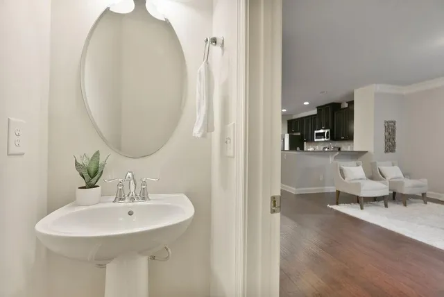 a en suite bathroom with a sink and a mirror