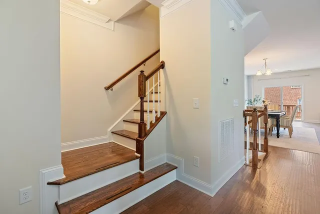 a view of entryway and hall with wooden floor