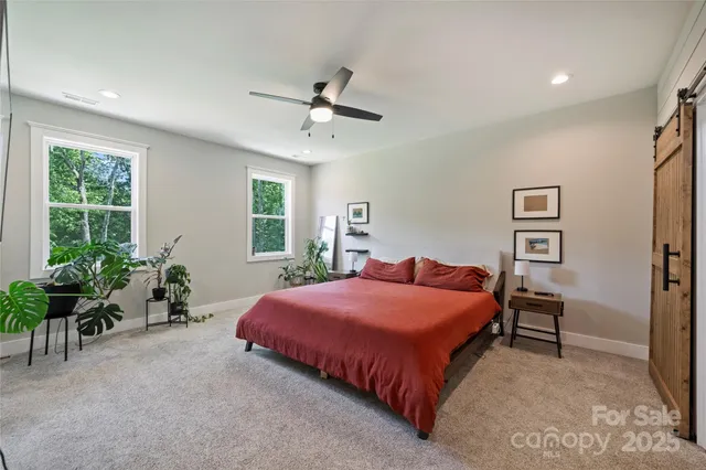 a bedroom with a bed and furniture