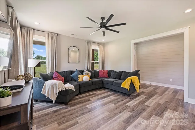 a living room with furniture and a window