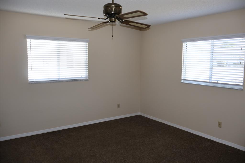 6522 Southwest 60th Court Ocala, FL 34474 - Photo 14 of 23 an empty room with a window