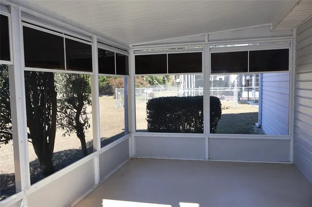 a bathroom with a walk in closet and a window