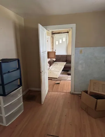 a room with furniture and a wooden floor