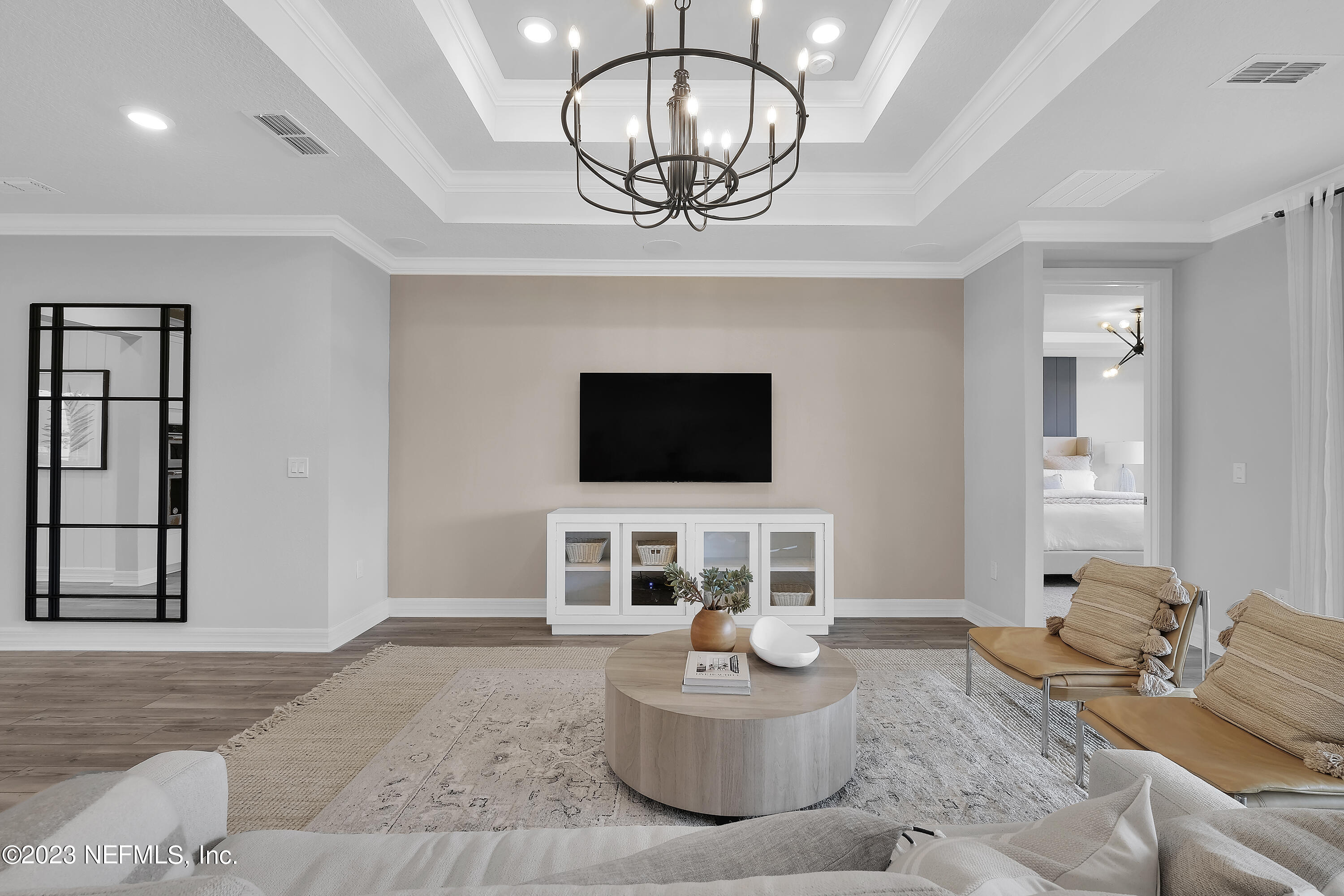 12435 Clapboard Blf Trail Jacksonville, FL 32226 - Photo 15 of 30 a living room with furniture a flat screen tv and kitchen view