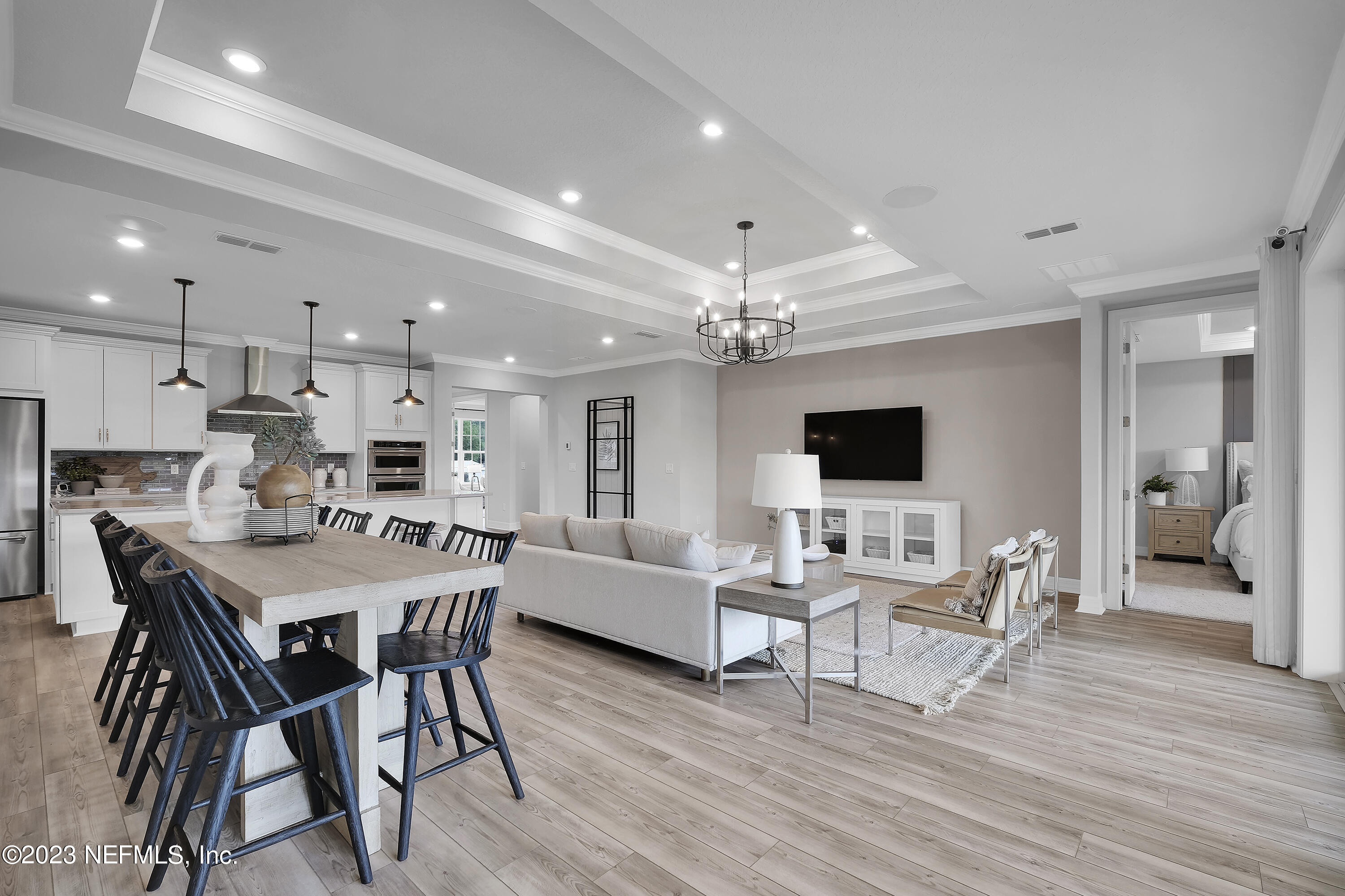 12435 Clapboard Blf Trail Jacksonville, FL 32226 - Photo 16 of 30 a view of a dining room with furniture and wooden floor