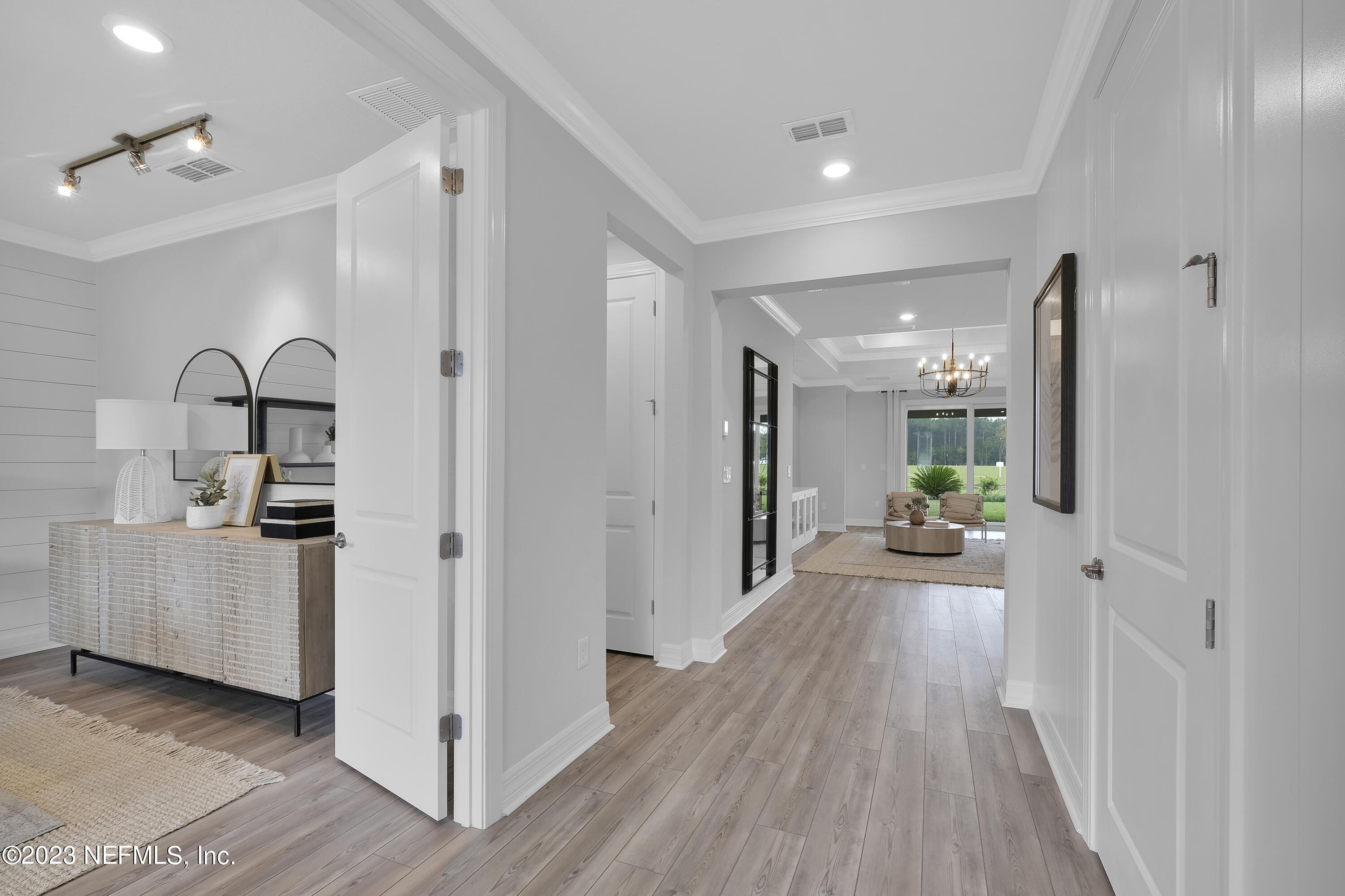 12435 Clapboard Blf Trail Jacksonville, FL 32226 - Photo 2 of 30 a very nice looking room with a large window and wooden floor