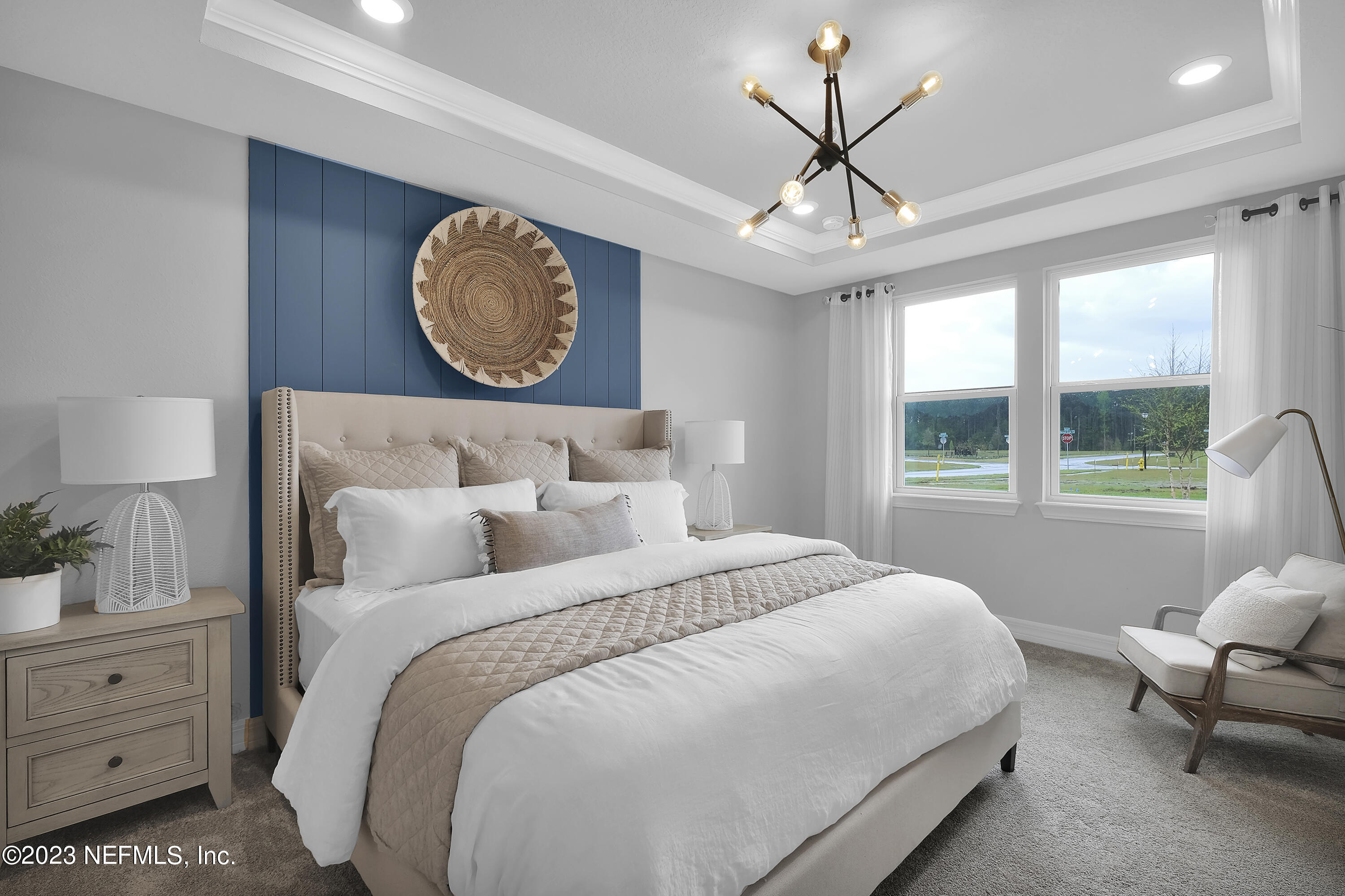 12435 Clapboard Blf Trail Jacksonville, FL 32226 - Photo 22 of 30 a bedroom with a bed a chandelier and a window