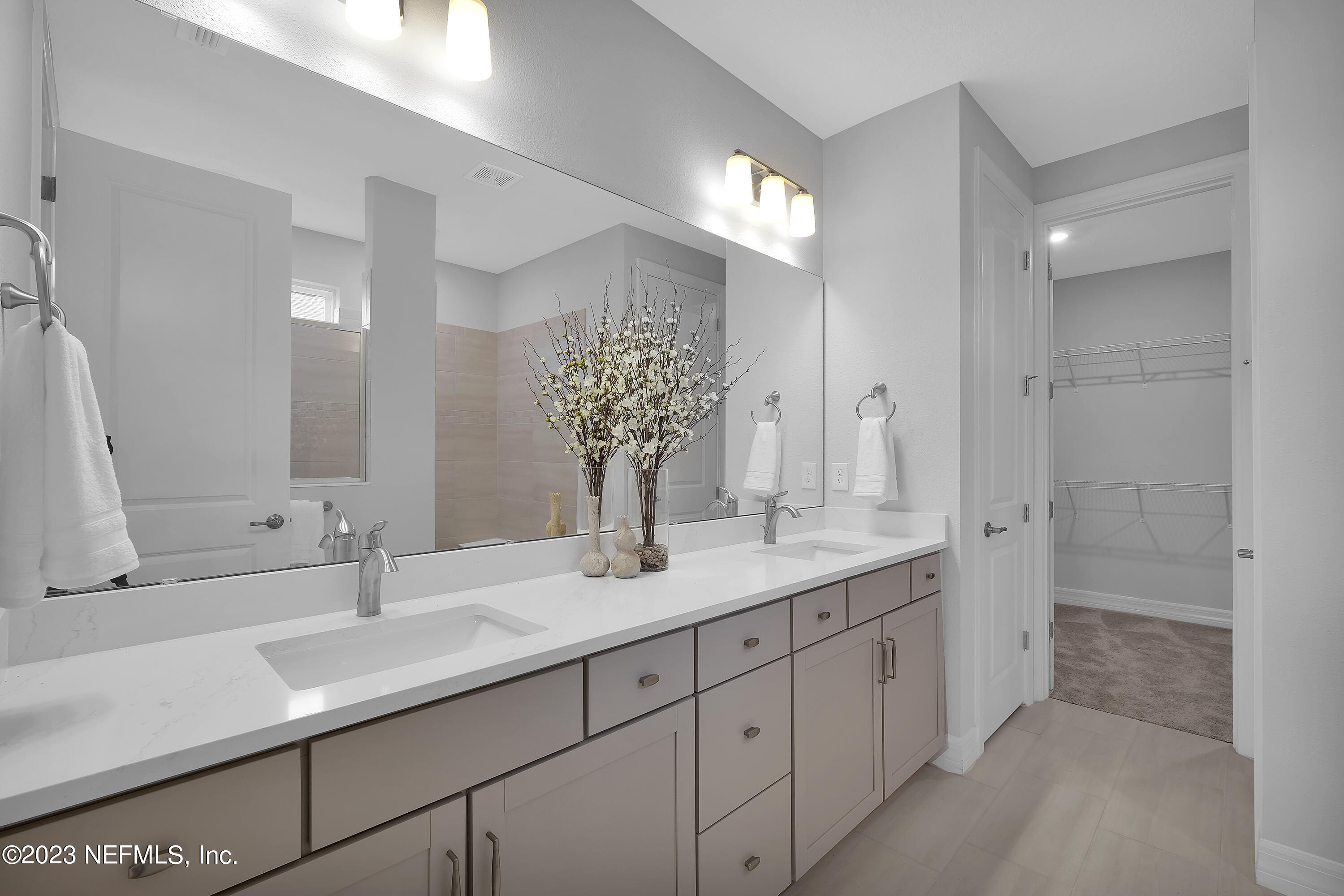 12435 Clapboard Blf Trail Jacksonville, FL 32226 - Photo 24 of 30 a bathroom with a double vanity sink and a mirror