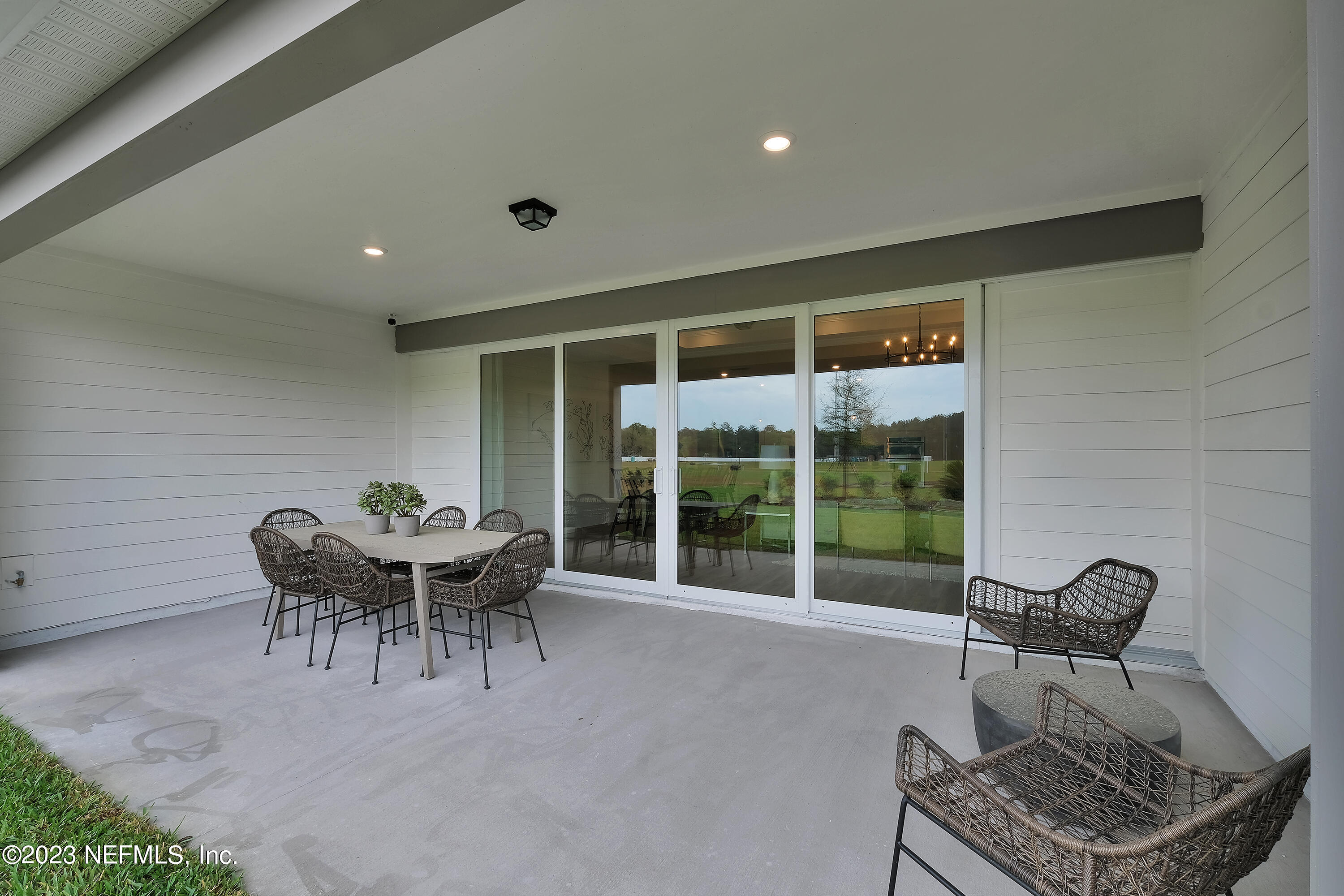 12435 Clapboard Blf Trail Jacksonville, FL 32226 - Photo 25 of 30 a dining room with furniture and large windows