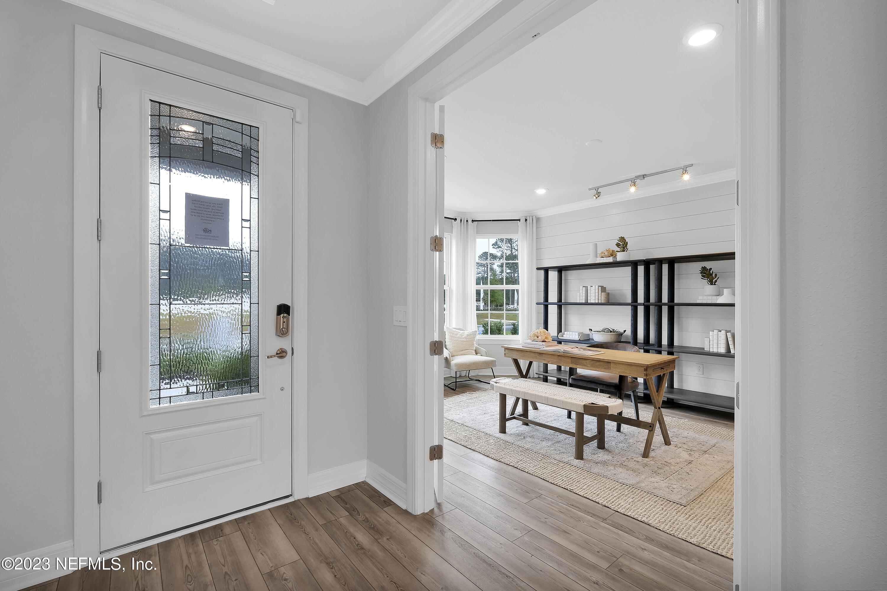 12435 Clapboard Blf Trail Jacksonville, FL 32226 - Photo 3 of 30 a view of a workspace with wooden floor and a window