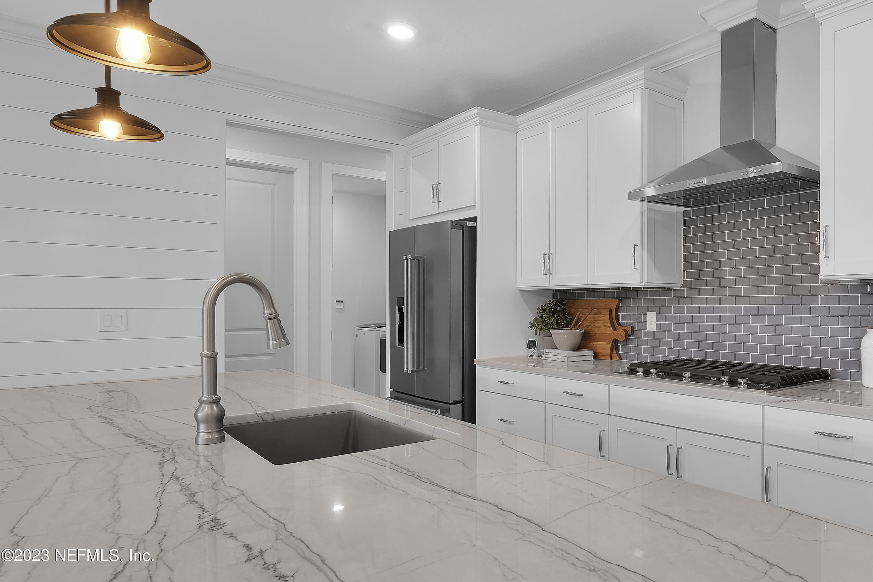 12435 Clapboard Blf Trail Jacksonville, FL 32226 - Photo 7 of 30 a kitchen with stainless steel appliances granite countertop a sink a stove and refrigerator