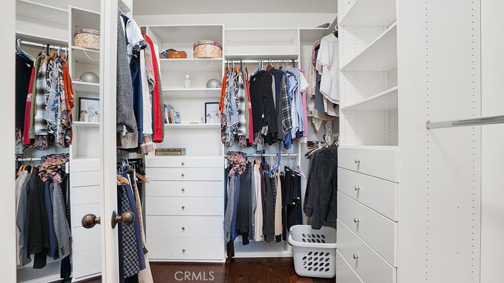 473 Camino Flora Vista San Clemente, CA 92673 - Photo 27 of 59 a view of walk in closet with clothes and shoes
