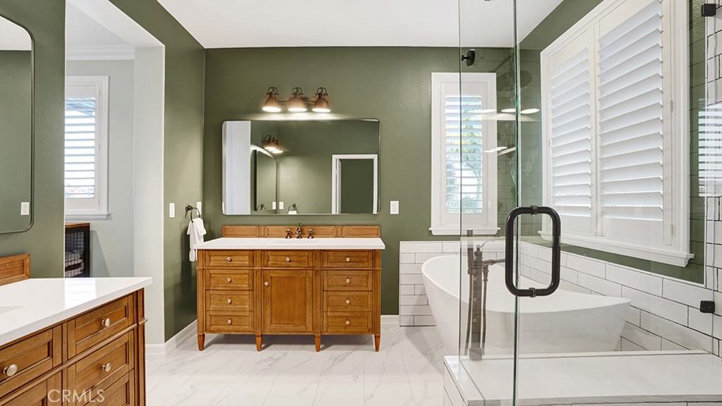 473 Camino Flora Vista San Clemente, CA 92673 - Photo 28 of 59 a bathroom with a double vanity sink and a mirror