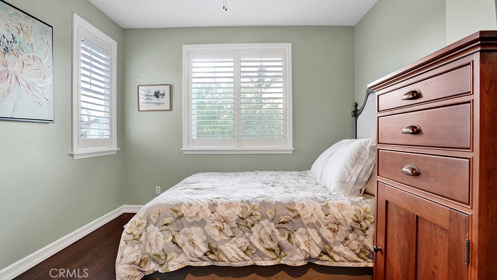 473 Camino Flora Vista San Clemente, CA 92673 - Photo 31 of 59 a bedroom with a bed and window with cabinet