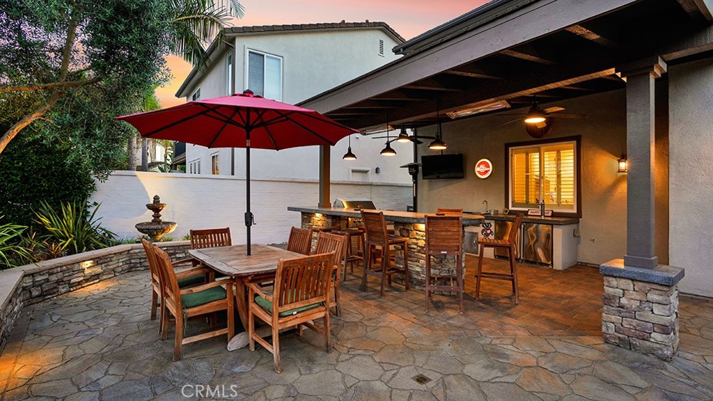 473 Camino Flora Vista San Clemente, CA 92673 - Photo 41 of 59 a view of a roof deck with table and chairs under an umbrella