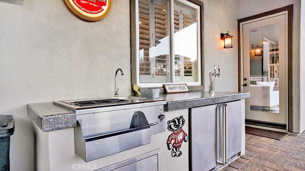 473 Camino Flora Vista San Clemente, CA 92673 - Photo 46 of 59 a kitchen with a sink stove and cabinets