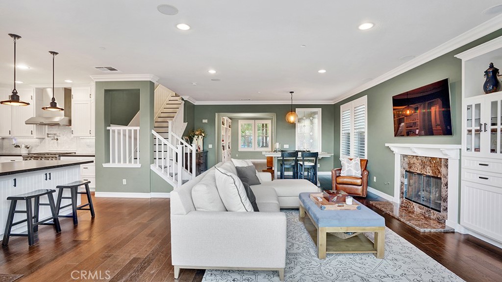 473 Camino Flora Vista San Clemente, CA 92673 - Photo 10 of 59 a living room with fireplace furniture and a flat screen tv