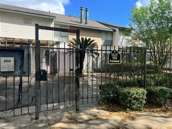 a view of a backyard with potted plants