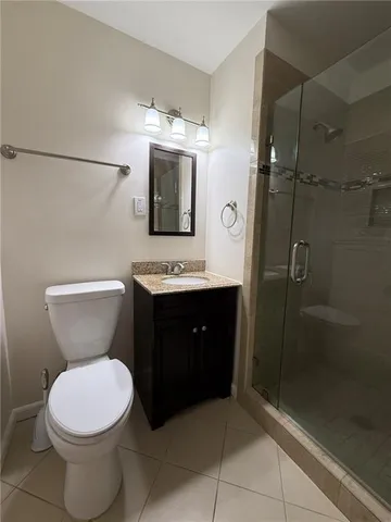 a bathroom with a toilet sink and shower