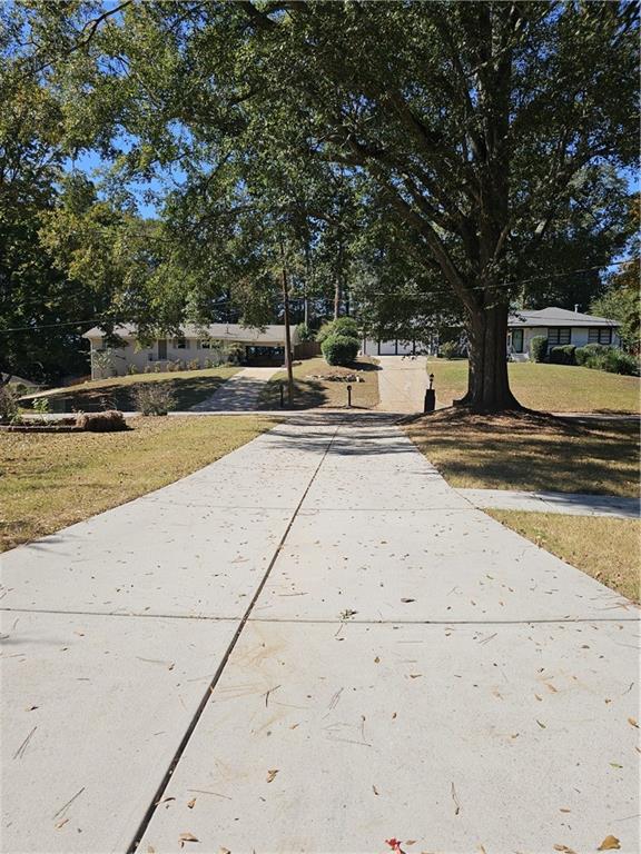 3085 Stantondale Drive Atlanta, GA 30341 - Photo 3 of 20 a view of a swimming pool with an outdoor space